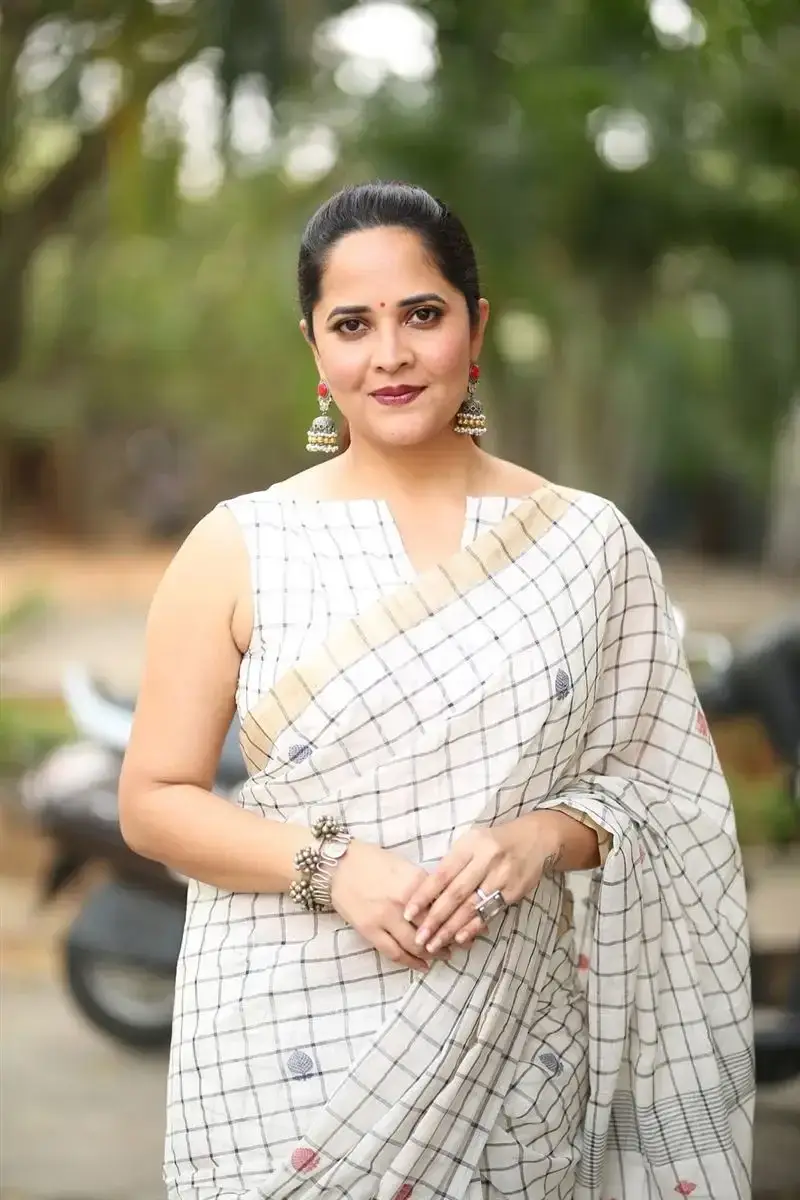 Anasuya Bharadwaj in White Saree at Razakar Movie Launch